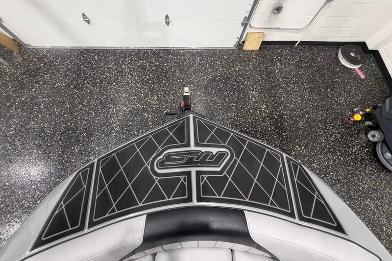 Slide: The Image of 2024 MB B52 23 Classic boat deck with logo, in a garage setting. - 16