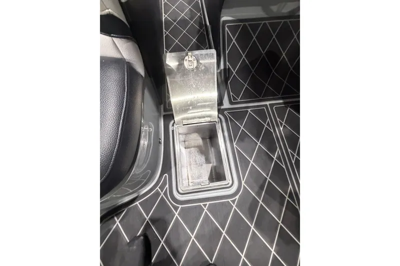 Slide: The Image of 2024 MB B52 23 Classic interior with diamond-patterned floor mats and metal compartment. - 68