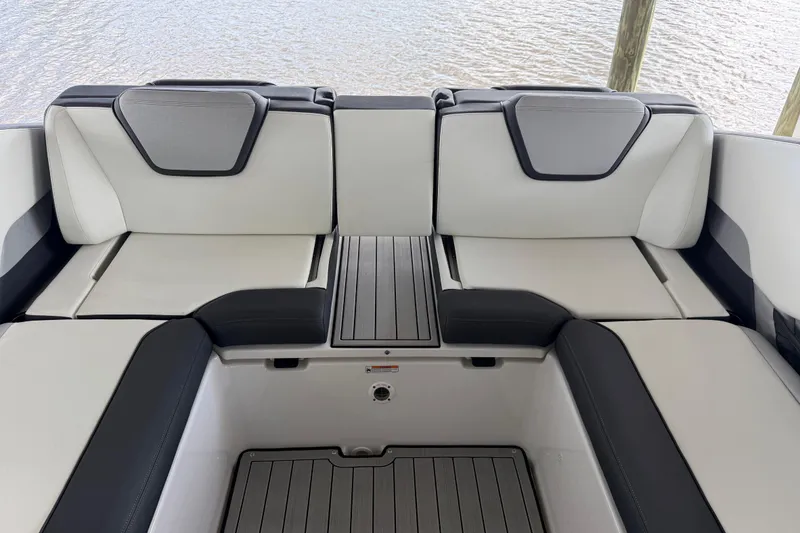 Slide: The Image of 2022 Yamaha Boats 252SD interior seating with sleek, modern design and comfortable upholstery. - 15