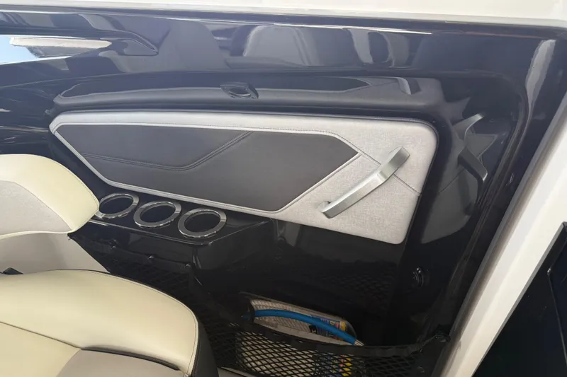 Slide: The Image of Interior view of 2022 Yamaha Boats 252SD, featuring sleek design and cup holders. - 31
