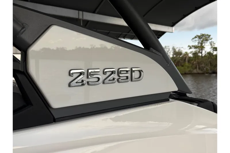 Slide: The Image of 2022 Yamaha Boats 252SD model emblem on a sleek white surface. - 7