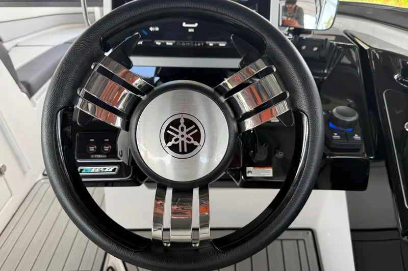 Slide: The Image of Steering wheel of 2022 Yamaha Boats 252SD, featuring sleek design and modern controls. - 42