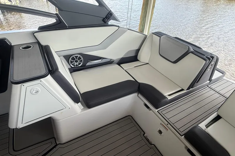 Slide: The Image of 2022 Yamaha Boats 252SD interior with sleek seating and modern design. - 16