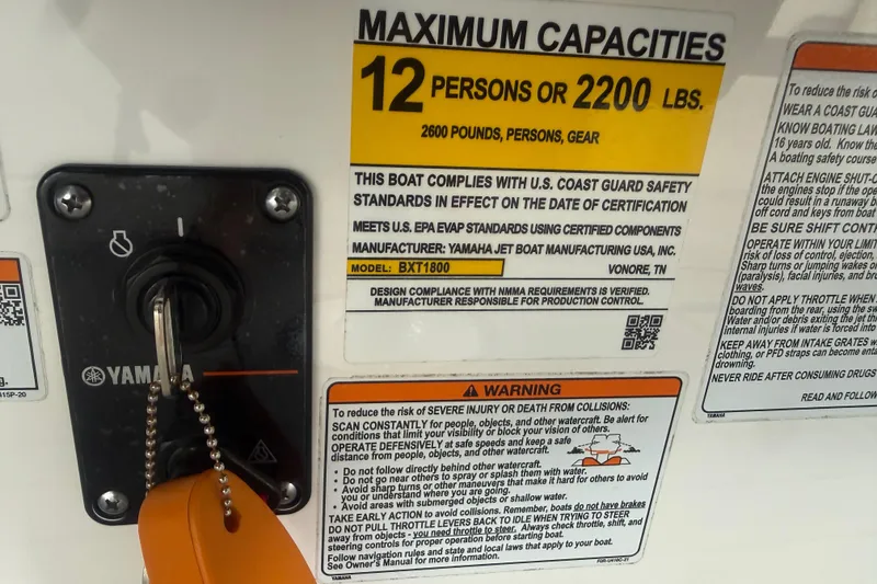 Slide: The Image of 2022 Yamaha Boats 252SD capacity label, 12 persons or 2200 lbs, safety compliance details. - 47