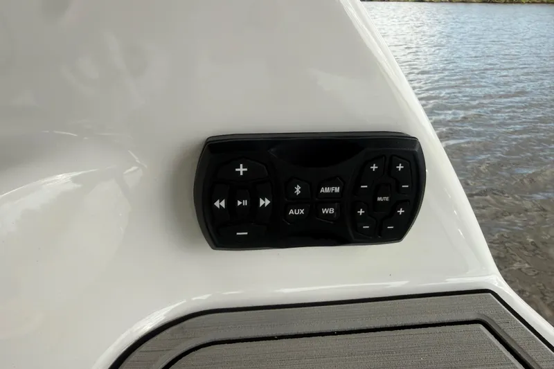 Slide: The Image of Yamaha Boats 252SD 2022 audio control panel on white boat interior. - 13