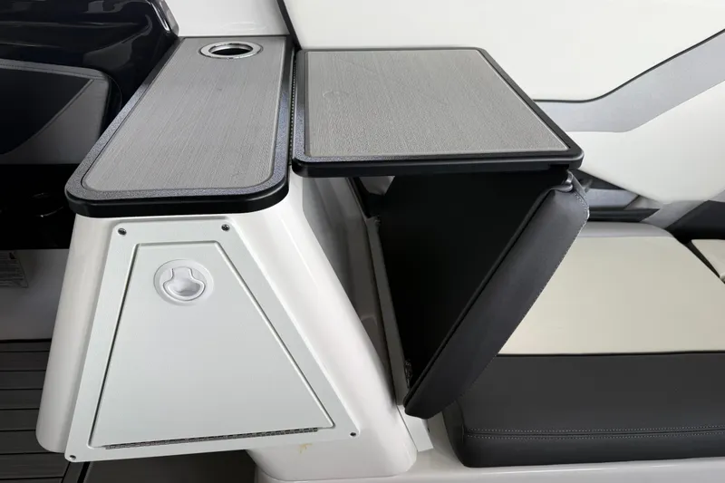 Slide: The Image of 2022 Yamaha Boats 252SD interior with sleek seating and foldable table design. - 17