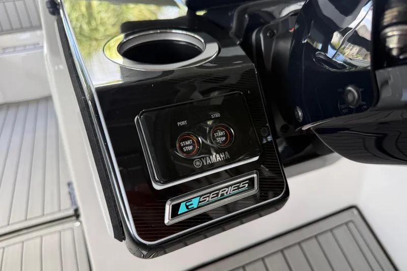 Slide: The Image of Close-up of 2022 Yamaha Boats 252SD E-Series control panel with start/stop buttons. - 43