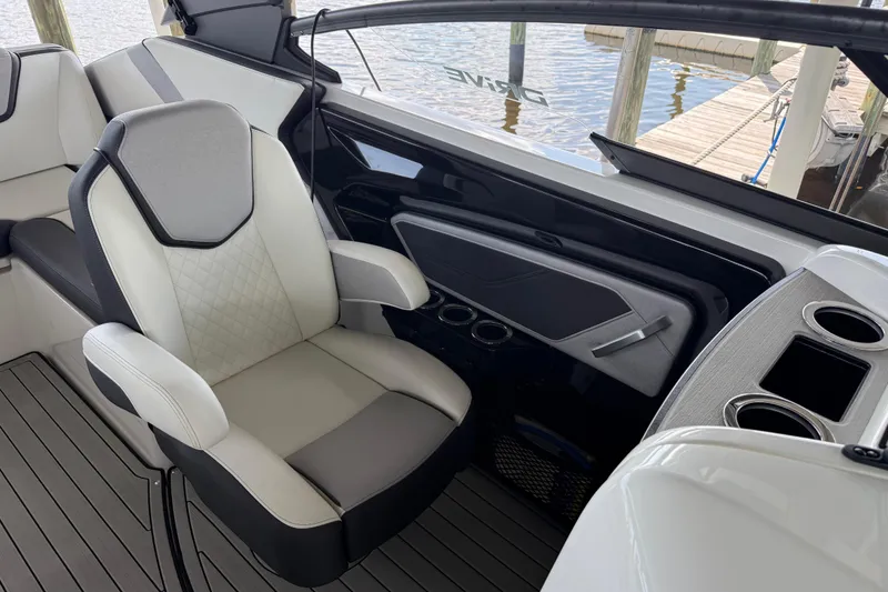 Slide: The Image of Interior of 2022 Yamaha Boats 252SD, featuring luxurious seating and modern design elements. - 30