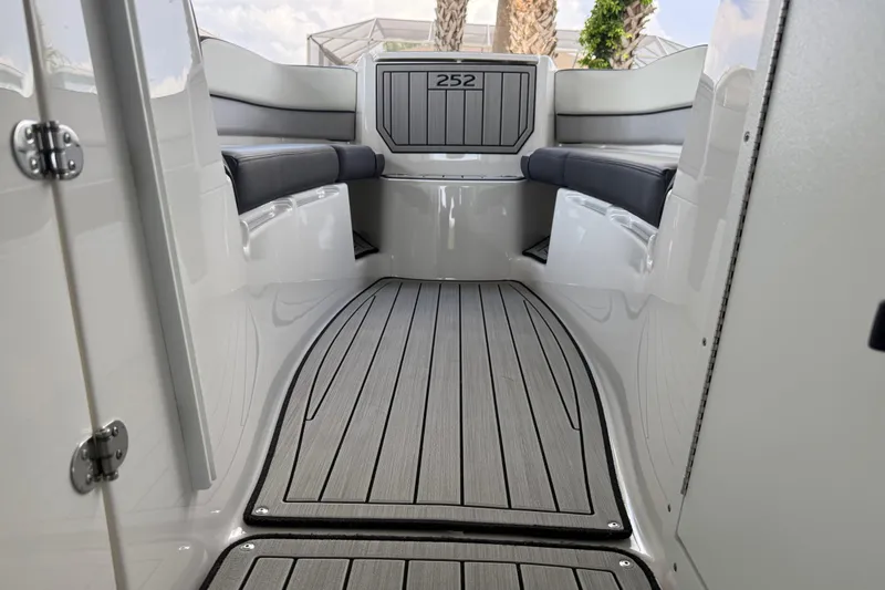 Slide: The Image of 2022 Yamaha Boats 252SD interior with sleek seating and modern flooring. - 61