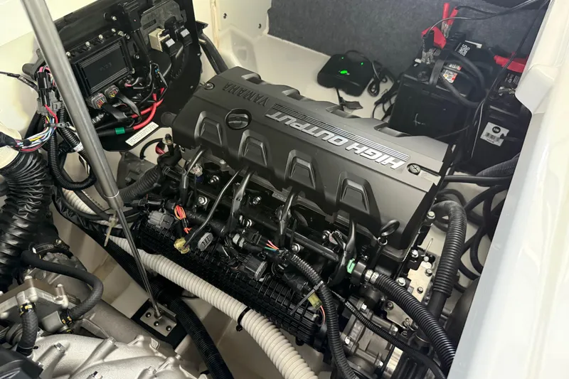 Slide: The Image of Engine compartment of 2022 Yamaha Boats 252SD, showcasing high output engine and wiring. - 25