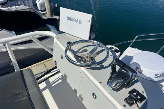 Slide: The Image of 2023 Defiance Guadalupe 290 EX boat helm with Simrad navigation system. - 21