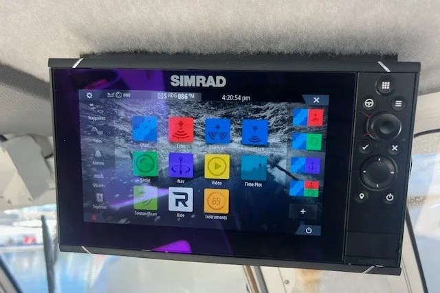 Slide: The Image of Simrad marine display on 2023 Defiance Guadalupe 290 EX boat, showing navigation and control interface. - 14