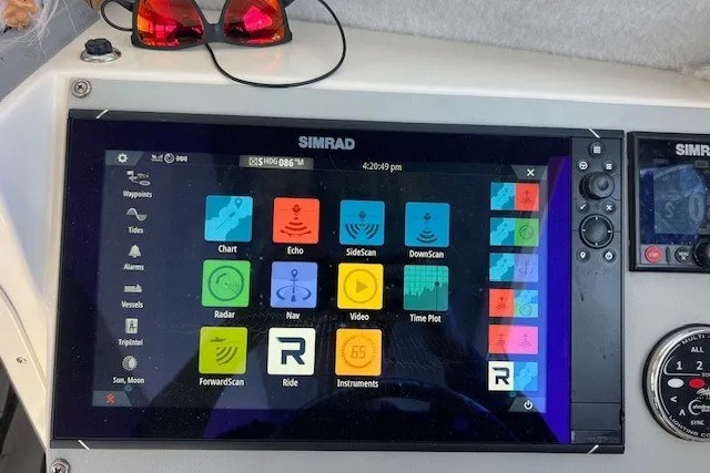 Slide: The Image of Simrad navigation display on 2023 Defiance Guadalupe 290 EX boat dashboard. - 13