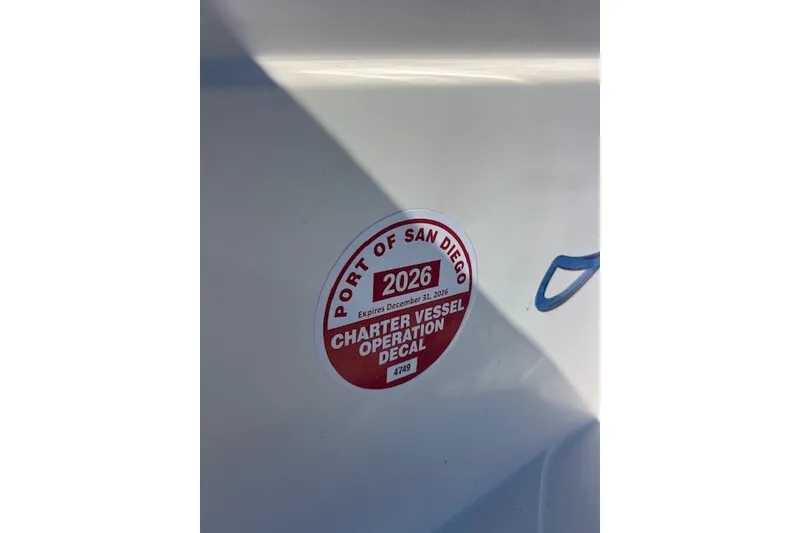 Slide: The Image of Red charter vessel decal on Defiance Guadalupe 290 EX, Port of San Diego, expires 2026. - 17
