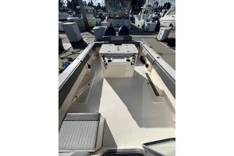 Slide: The Image of 2023 Defiance Guadalupe 290 EX boat interior with spacious deck and seating. - 6