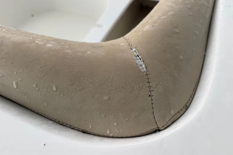 Slide: The Image of Close-up of a worn seat cushion on a 2017 Hurricane SunDeck 187 OB boat. - 21