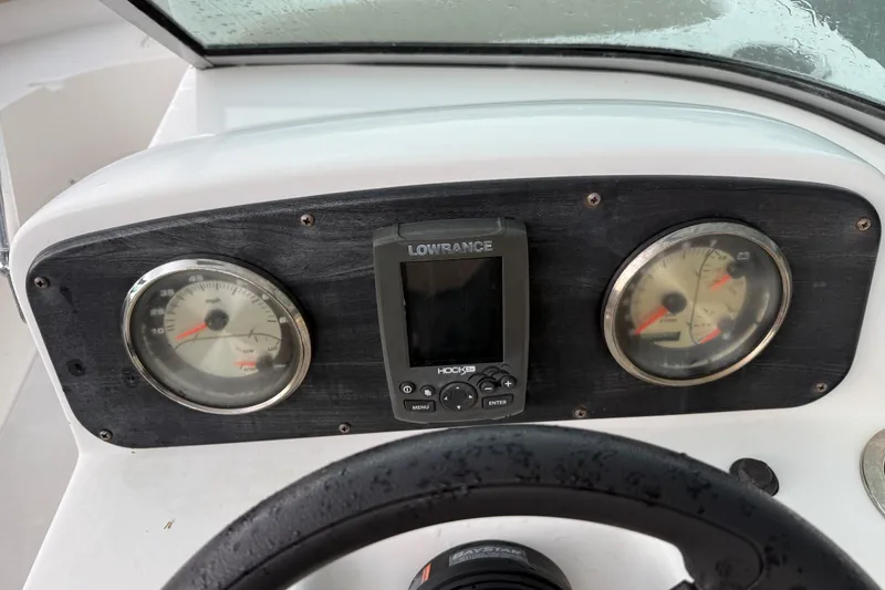 Slide: The Image of Dashboard of 2017 Hurricane SunDeck 187 OB with gauges and Lowrance display. - 14