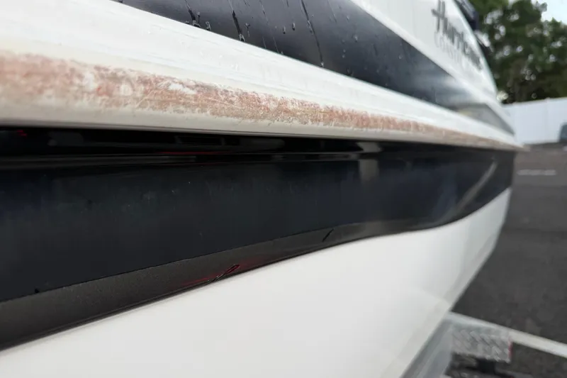 Slide: The Image of Close-up of 2017 Hurricane SunDeck 187 OB boat hull with visible wear. - 8