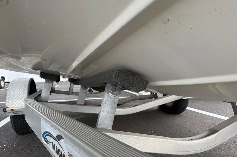 Slide: The Image of 2017 Hurricane SunDeck 187 OB boat on trailer, close-up view of hull and support. - 26