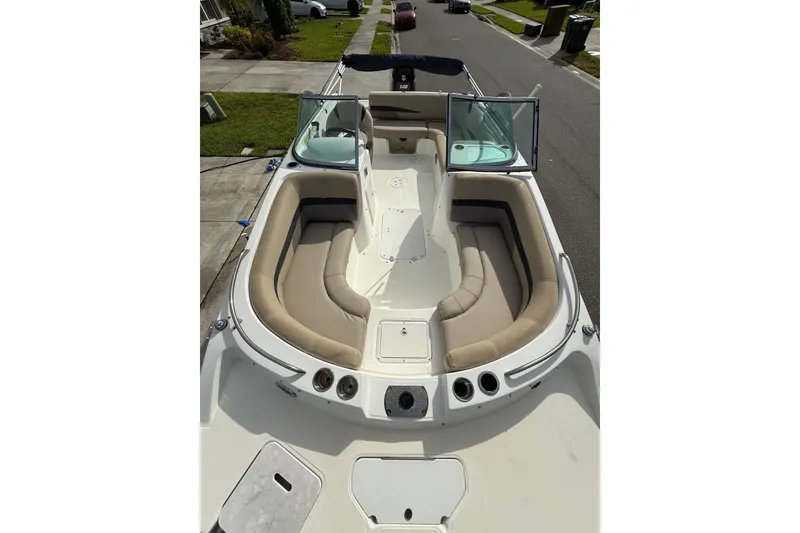 Slide: The Image of 2017 Hurricane SunDeck 187 OB boat with spacious seating and open deck layout. - 19