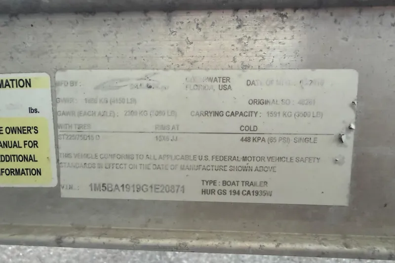 Slide: The Image of Label on a 2017 Hurricane SunDeck 187 OB boat trailer, showing specifications and safety standards. - 27