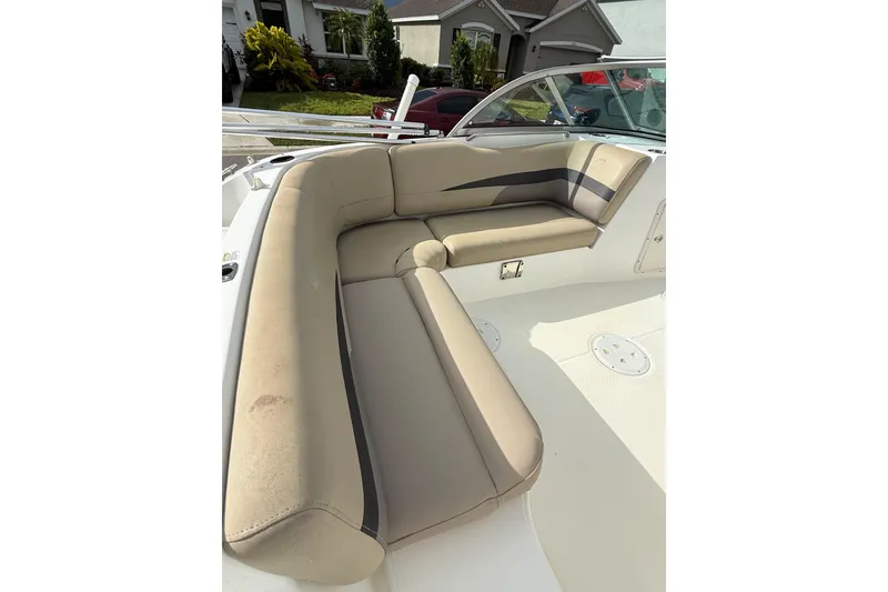 Slide: The Image of 2017 Hurricane SunDeck 187 OB boat interior with beige seating and spacious layout. - 11