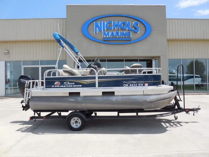 The Image of 2020 Sun Tracker BASS BUGGY 16XL in front of a building with "Nichols Marine" sign. - 1
