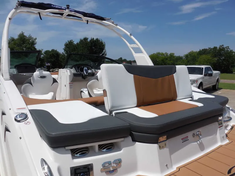 Slide: The Image of The image shows the rear of a Chaparral 23 SSi boat with stylish seating. - 12