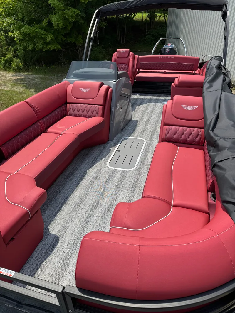 Slide: The Image of The image shows the interior of a 2025 Bennington 26LXSSB with red leather seating. - 5