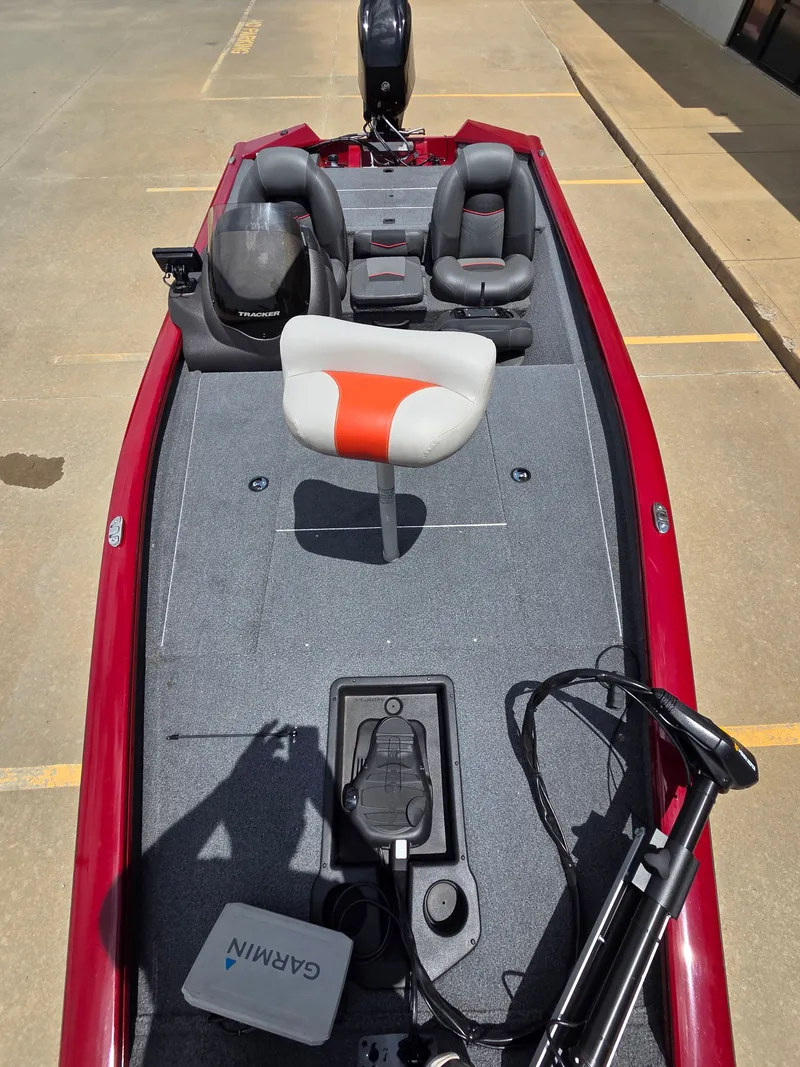 Slide: The Image of A 2022 Tracker Pro Team 175 TXW boat with a gray deck and red accent. - 10