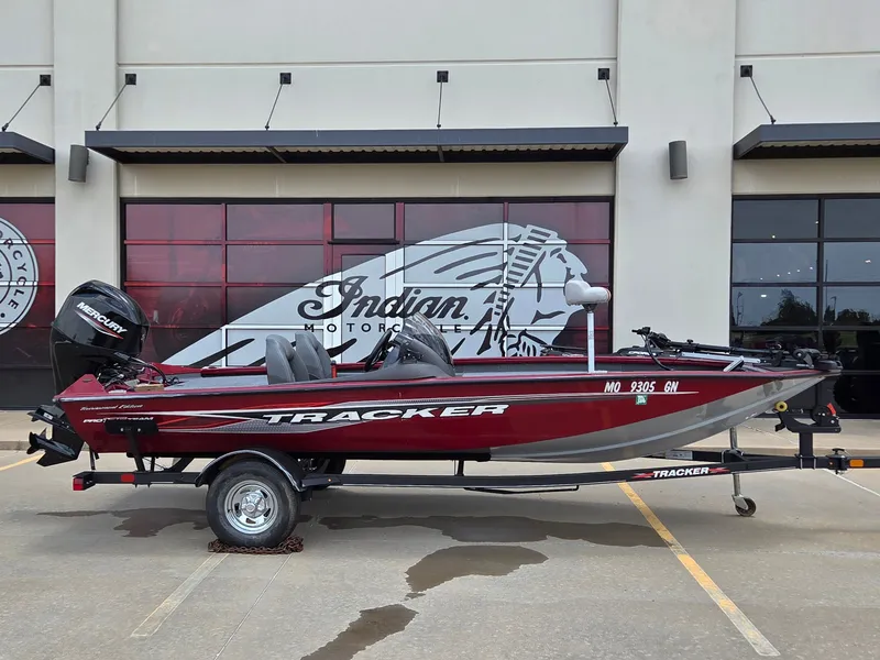 The Image of 2022 Tracker Pro Team 175 TXW on a trailer in front of a building. - 1