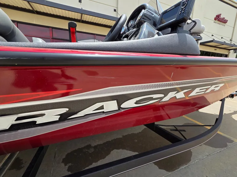 Slide: The Image of Close-up of a red 2022 Tracker Pro Team 175 TXW boat on a trailer. - 12