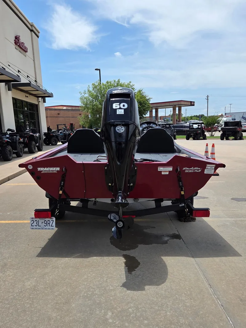 Slide: The Image of Red 2022 Tracker Pro Team 175 TXW with outboard motor, parked on a lot. - 7