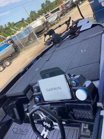 Slide: The Image of The image shows the cockpit of a 2026 Bass Cat Lynx STS with a Garmin navigation system. - 42