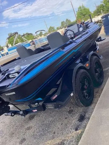 Slide: The Image of A 2026 Bass Cat Lynx STS on a trailer. The boat features a sleek, modern design. - 47