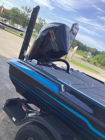 Slide: The Image of The image shows a 2026 Bass Cat Lynx STS boat with a powerful outboard motor. - 44