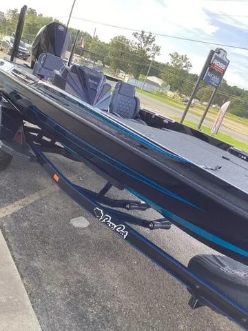 Slide: The Image of A 2026 Bass Cat Lynx STS on a trailer in a parking lot. - 31