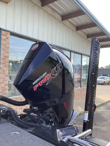 Slide: The Image of A Mercury Pro XS outboard motor is mounted on a Bass Cat Lynx STS boat. - 9