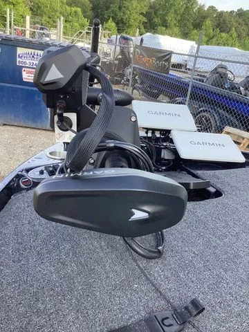 Slide: The Image of A 2026 Bass Cat Lynx STS with Garmin equipment on a gray deck. - 20