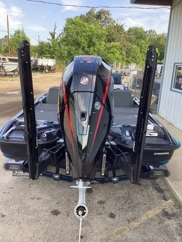 Slide: The Image of The image shows a 2026 Bass Cat Lynx STS boat with a powerful outboard motor. - 5