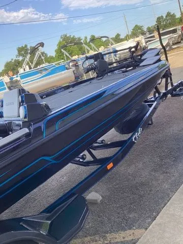 Slide: The Image of A 2026 Bass Cat Lynx STS on a trailer. The boat features a sleek, modern design. - 45