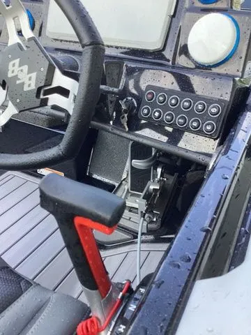 Slide: The Image of Close-up of a Bass Cat Lynx STS helm with modern controls and steering wheel. - 38