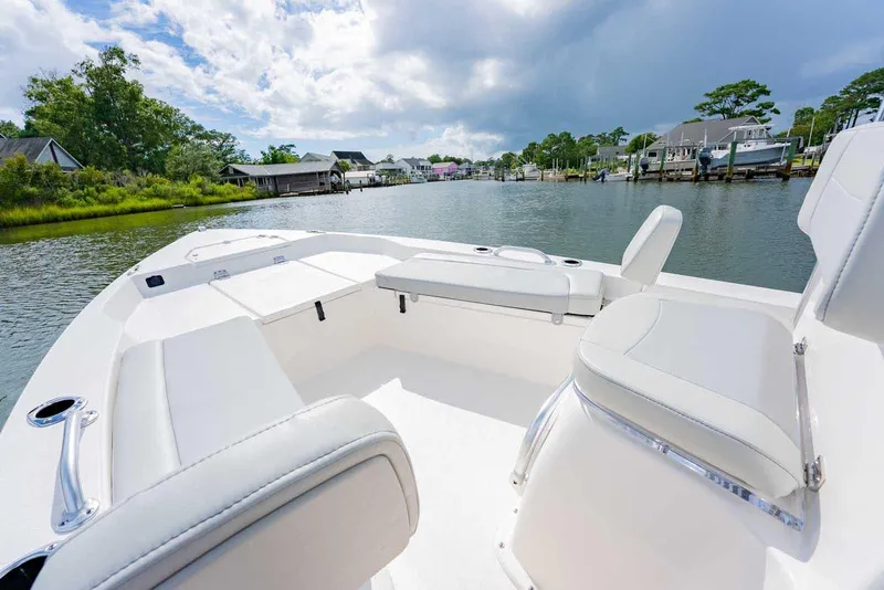 Slide: The Image of Manufacturer Provided Image: 2025 Bay Rider 219 Bay boat interior on a scenic waterway. - 8