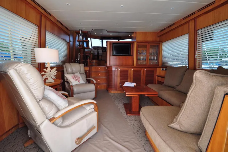 Slide: The Image of Luxurious yacht interior with plush seating, wooden accents, and a TV, Symbol 56 model, 2003. - 8