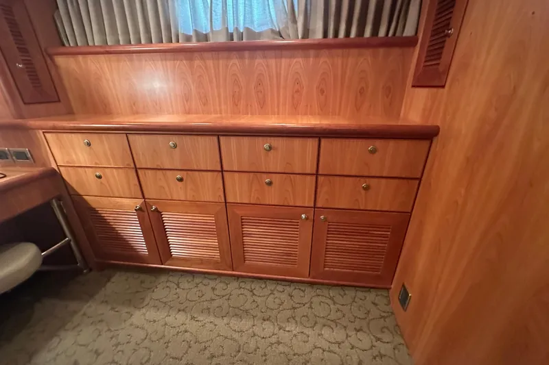 Slide: The Image of Wooden cabinetry with drawers and louvered doors, Symbol 56 yacht interior, 2003 model. - 46
