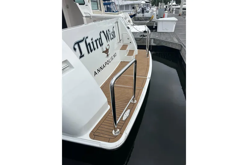 Slide: The Image of Luxury yacht "Third Wish" docked, featuring teak deck and chrome railings, Annapolis, MD. - 7