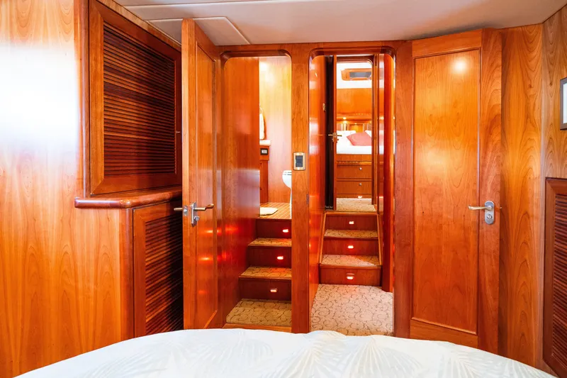 Slide: The Image of Luxurious wooden interior of a 2003 Symbol 56 yacht cabin with stairs and doors. - 80