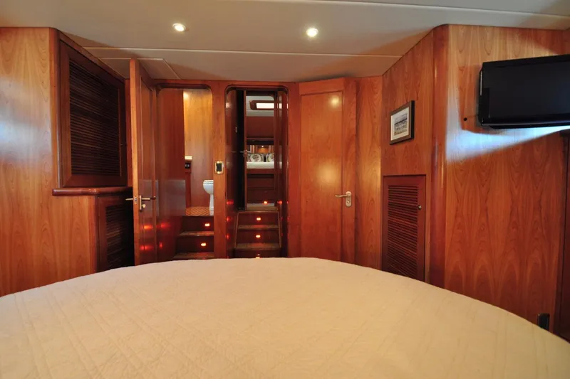 Slide: The Image of Luxurious yacht interior with wood paneling, cozy lighting, and modern amenities, Symbol 56, 2003. - 22
