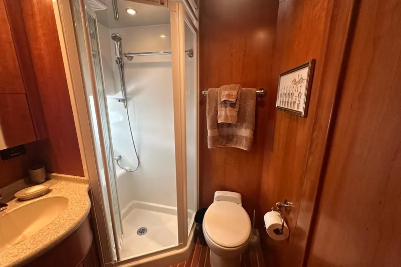 Slide: The Image of Compact bathroom with shower, toilet, and wooden decor in a 2003 Symbol 56 model. - 59