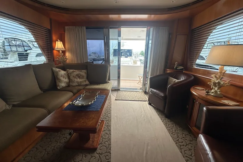 Slide: The Image of Luxurious yacht interior with elegant seating, wooden accents, and decorative lighting, Symbol 56, 2003 model. - 25